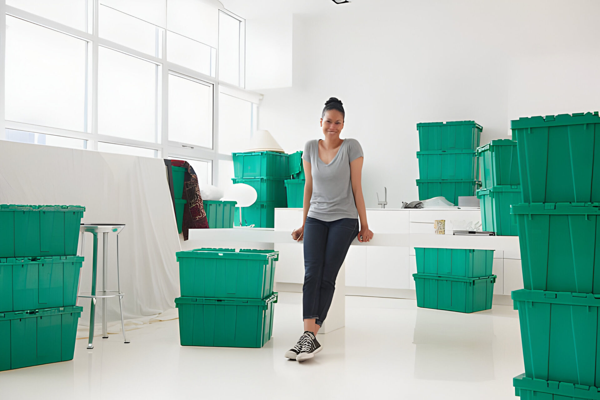 A neatly organized garage with labeled storage bins on metal shelves.